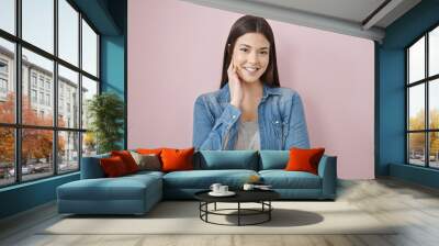 Young beautiful hispanic woman smiling confident standing over isolated pink background Wall mural