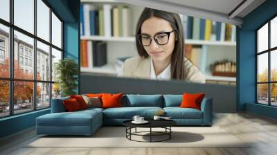 Young beautiful hispanic woman student using computer studying at university classroom Wall mural