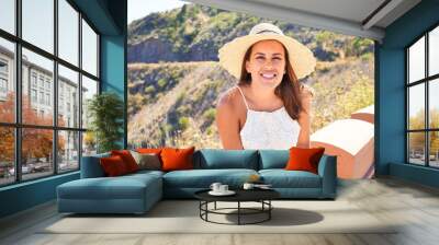 Young beautiful woman enjoying summer vacation on mountain landscape, traveler girl smiling happy Wall mural