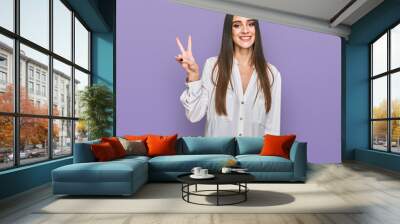 Young beautiful woman wearing casual white shirt showing and pointing up with fingers number two while smiling confident and happy. Wall mural