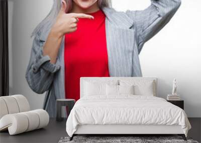 Young blonde business woman wearing fashion jacket over isolated background smiling making frame with hands and fingers with happy face. Creativity and photography concept. Wall mural