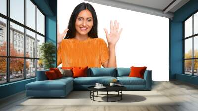 Young brunette arab woman wearing casual clothes showing and pointing up with fingers number ten while smiling confident and happy. Wall mural