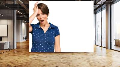 Young brunette woman with short hair wearing casual clothes surprised with hand on head for mistake, remember error. forgot, bad memory concept. Wall mural