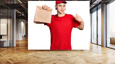 Young caucasian boy with ears dilation holding take away paper bag pointing finger to one self smiling happy and proud Wall mural