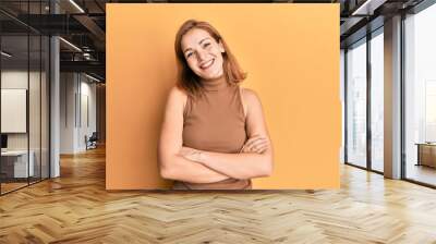 young caucasian woman wearing casual style with sleeveless dress happy face smiling with crossed arm Wall mural