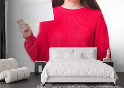 Young Chinese woman over isolated background holding blank card with a happy face standing and smiling with a confident smile showing teeth Wall mural