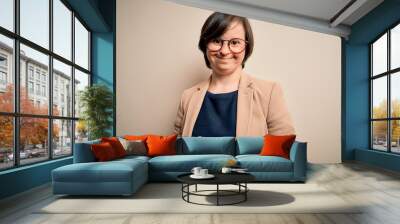 Young down syndrome business woman wearing glasses standing over isolated background with a happy and cool smile on face. Lucky person. Wall mural