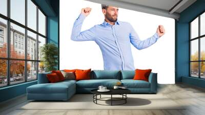 Young handsome blond man wearing elegant shirt dancing happy and cheerful, smiling moving casual and confident listening to music Wall mural