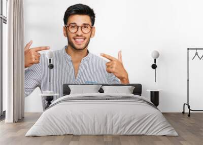 Young handsome man wearing casual clothes and glasses smiling cheerful showing and pointing with fingers teeth and mouth. dental health concept. Wall mural