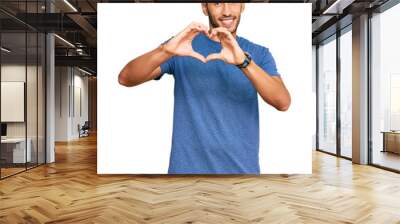 Young handsome man wearing casual clothes smiling in love showing heart symbol and shape with hands. romantic concept. Wall mural