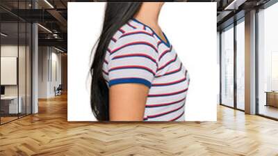 Young hispanic girl wearing casual striped t shirt looking to side, relax profile pose with natural face with confident smile. Wall mural