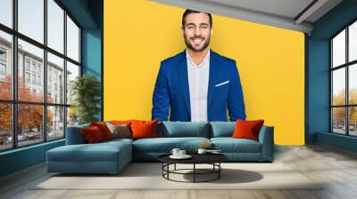 Young hispanic man wearing business jacket with a happy and cool smile on face. lucky person. Wall mural