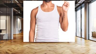 Young hispanic man wearing casual clothes showing and pointing up with finger number one while smiling confident and happy. Wall mural