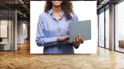 Young hispanic woman holding computer laptop with a happy face standing and smiling with a confident smile showing teeth Wall mural