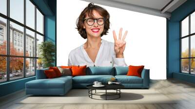 Young hispanic woman wearing business style and glasses showing and pointing up with fingers number three while smiling confident and happy. Wall mural