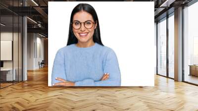 Young hispanic woman wearing casual clothes and glasses happy face smiling with crossed arms looking at the camera. positive person. Wall mural