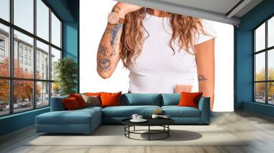 Young hispanic woman with tattoo wearing hardhat and builder clothes smiling doing phone gesture with hand and fingers like talking on the telephone. communicating concepts. Wall mural