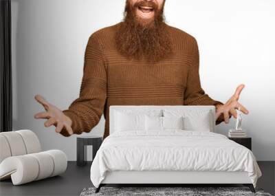 Young irish redhead man wearing casual clothes and glasses smiling cheerful with open arms as friendly welcome, positive and confident greetings Wall mural