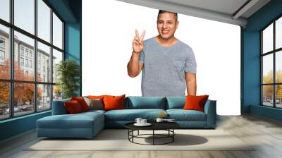 Young latin man wearing casual clothes showing and pointing up with fingers number two while smiling confident and happy. Wall mural