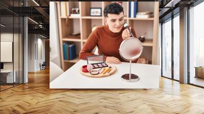 Young non binary man smiling confident applying makeup at home Wall mural