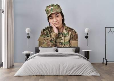 Young south asian woman wearing camouflage army uniform thinking looking tired and bored with depression problems with crossed arms. Wall mural