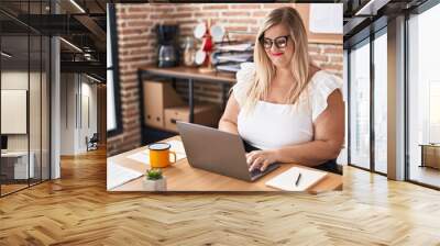 Young woman business worker using laptop working at office Wall mural