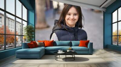 Young woman with down syndrome smiling confident standing at street Wall mural