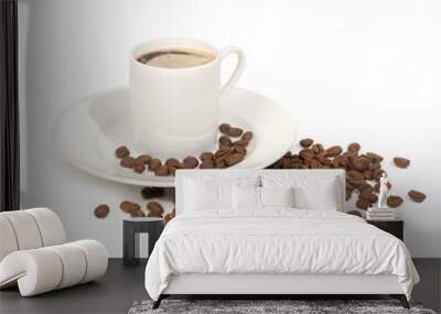 Cup of fresh hot espresso with froth and saucer and decoration of roasted beans, isolated on white background with object shadow.  Wall mural