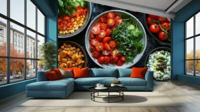 Many bowls of different vegetables and grains on the table, food background Wall mural