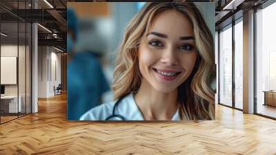 Smiling female doctor in scrubs and face mask standing in hospital, banner, copy space Wall mural