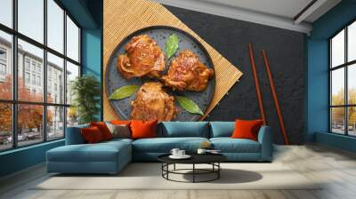 filipino chicken adobo on dark gray plate on black slate backdrop. chicken adobo is filipino cuisine Wall mural