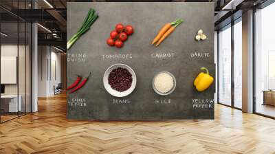 Flat lay food ingredients and vegetables with chalky signs on grey kitchen table.  Wall mural