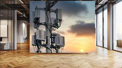 4G and 5G cellular. Macro Base Station or Base Transceiver Station. Telecommunication tower. Wireless Communication Antenna Transmitter. Development of communication systems in urban area at sunset. Wall mural