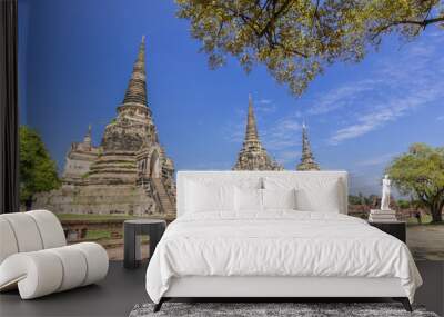 Tourist visit Pagoda and blue sky in Wat Phra Si Sanphet. The ancient temple of Ayutthaya Thailand. Wall mural