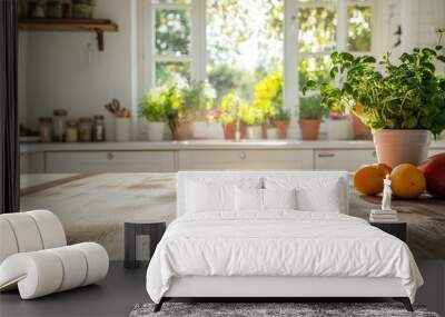 Wooden kitchen table with blurred background of a window with a plant in a pot,  sunlight through the window, and two oranges and a red apple. Wall mural