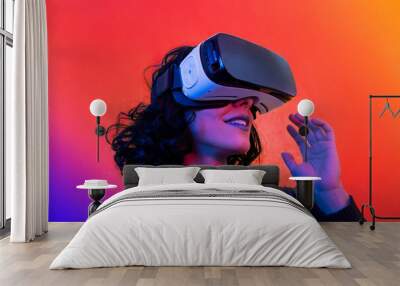 The young woman is using virtual reality viewer. Modern woman portrait with trendy look and bright colors. Wall mural