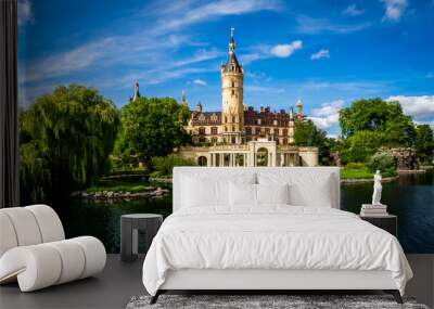 lake view of the popular schwerin castle the seat of the regional government office in mecklenburg western pomerania in front of blue sky with nice cloudscape at daytime on a lovely summer day Wall mural