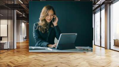 Portrait of beautiful smiling young  entrepreneur businesswoman working in modern work station. Wall mural