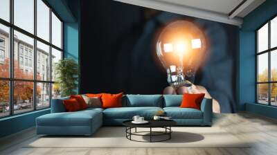 Innovation or creative concept of hand hold a light bulb and copy space for insert text. Wall mural