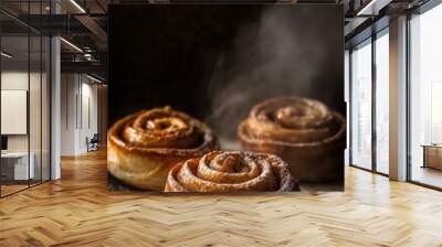 Freshly baked cinnamon rolls dusted with powdered sugar resting on a rustic wooden surface with steam rising in a warm kitchen Wall mural