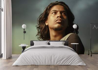 Young man portrait with long hair in evening light Wall mural