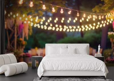 blurry garden wedding background decorated with fairy lights in summer Wall mural