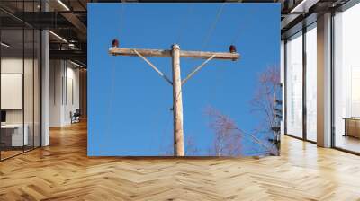 Old electricity line on wood pole with blue sky Wall mural