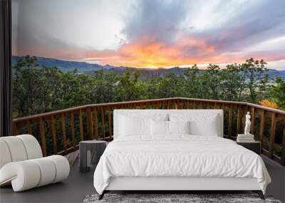 Aspen, Colorado house real estate view with wooden deck railing on balcony terrace and autumn foliage in roaring fork valley in 2019 and sunset Wall mural