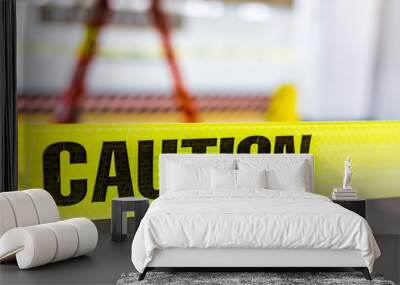 Caution tape sign in underground transit empty large platform in New York City NYC Subway Station in Grand Central, ladder, wet floor cone Wall mural