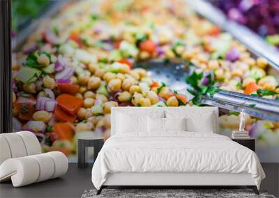 Chickpea salad in tray in bar with spoon Wall mural