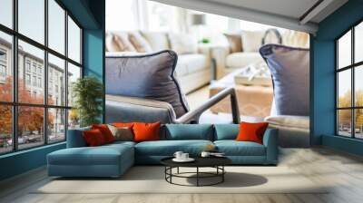 Modern living room with chairs and sofas, with many widows and bright natural light Wall mural