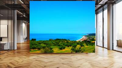 Fantastic overview from the San Giovanni in Venere abbey with huge swathes of deep green land descending to the populated coastline and perfect blue waters on a sunny day Wall mural