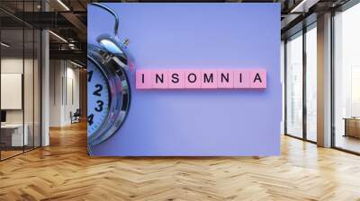 Insomnia word wooden cubes on purple violet background Wall mural