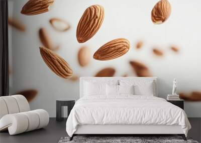 Isolated falling almond on white background, full depth of field  Wall mural